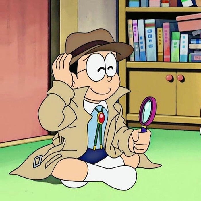 Ảnh Nobita mặc đồ thám tử cầm kính lúp soi xét