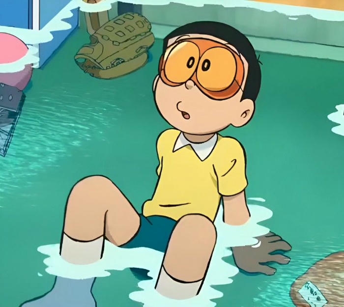 Hình nền Nobita đang bơi lội thỏa thích dưới nước xanh